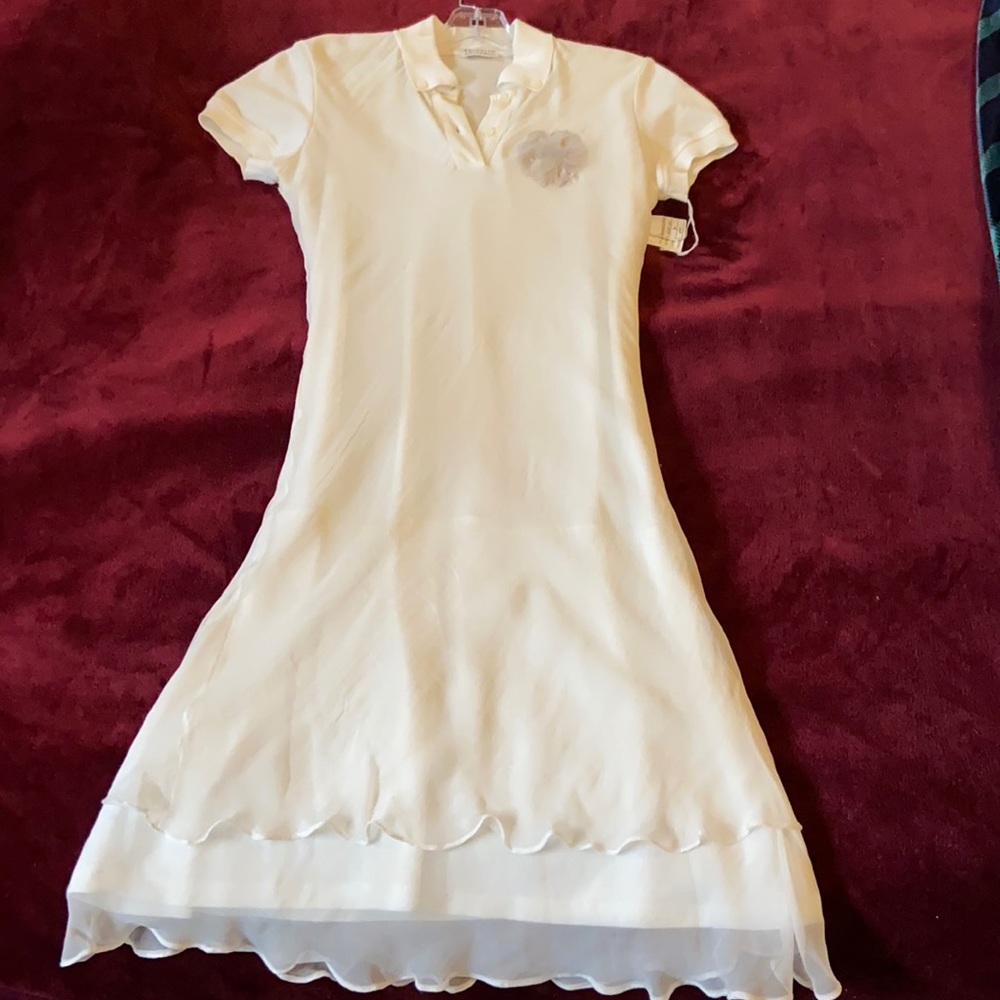 Off white Collared dress with accent flower.